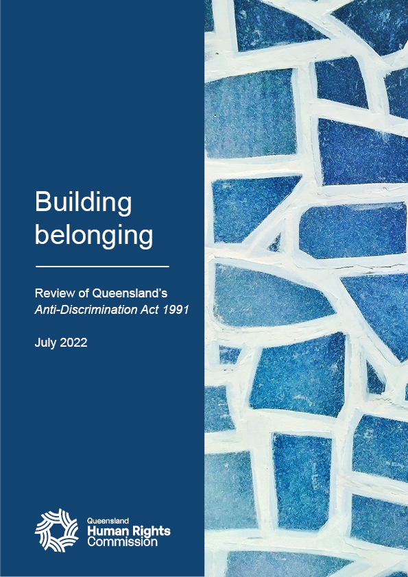 Front cover of the 'Building belonging' report. The cover is split vertically down the middle. The right half is a close up photo of a mosaic with unevenly shaped and sized blue tiles and white grout. The left is dark blue and contains the title of the report as follows: "Building belonging: Review of Queensland's Anti-Discrimination Act 1991; July 2022" and the QHRC logo. 